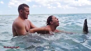 A couple enjoys an amazing and passionate sex session in the blue lagoon