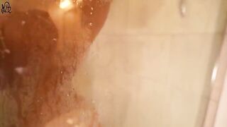 The cute girl has fun with a huge dildo in the shower, creating a wet and wild solo scene