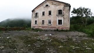 An exhibitionist girl is walking in an abandoned building with her hot girlfriend