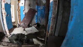 An exhibitionist girl is walking in an abandoned building with her hot girlfriend
