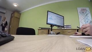 A business lady gets a loan from the bank for some extra money