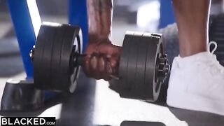 Two girls from the gym are having fun with two black guys