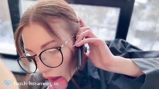 A hot woman chats on the phone with her husband while her friend gets intimate with her