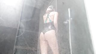 A woman has a wet sex in the shower and brings herself to squirting orgasm