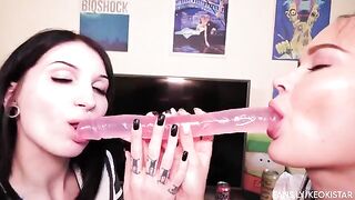 Two hot lesbian babes play with their pussy using a dildo and they finger each other