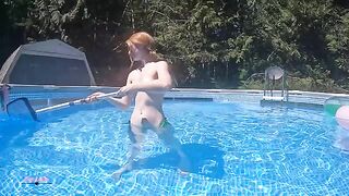 A short video showing a girl trying to strip outdoors but failing