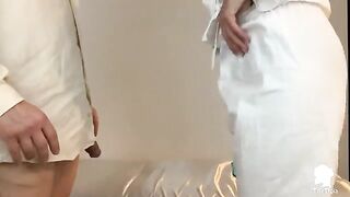 The nurse checks the patient's condition with Italian doctor