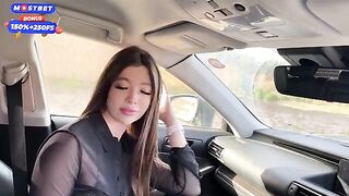 A girl got attached to a car and started to engage in oral play