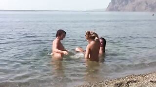 Three naked beauties on the beach with erporn action