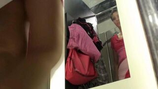 The peeping guy was spying for a girl in the locker room of the store