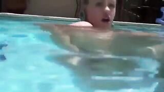 Babe in scuba gear plays with a dildo in her ass in the pool
