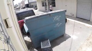 The chick was photographed during intimate moments behind the garbage tank