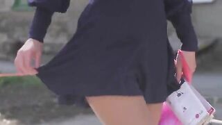 A very beautiful girl takes off her clothes