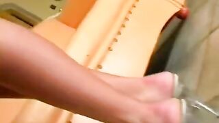 Beauty wearing leather underwear masturbates on the chair