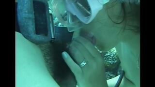 A man has sex with a girl under water in the pool