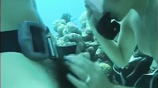 A man has sex with a girl under water in the pool