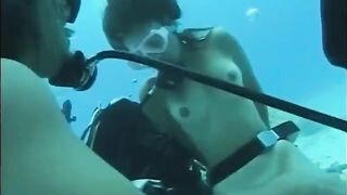 A man has sex with a girl under water in the pool