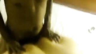 A fat woman lay down on a man with her big body and boobs