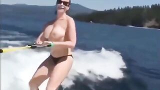 Topless girl skiing on water, it's a first time