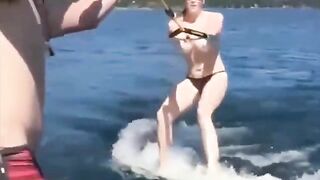 Topless girl skiing on water, it's a first time