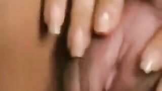 Girl with a big hairy pussy plays with her clit