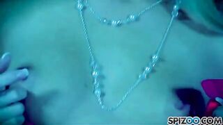 A blonde woman masturbating with a dildo in her wet pussy