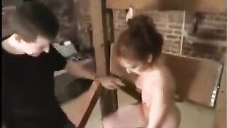 A sexy girl in bondage is fucked with a sex toy