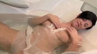 Brunette takes shower and rubs her pussy with her hands