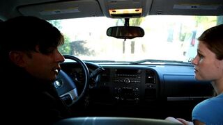 A hot girl is giving a blowjob to her friend in the car