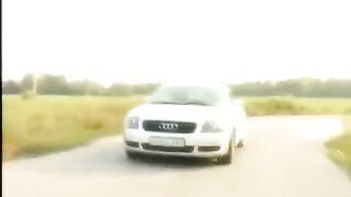 A cute girl has sex on the car bonnet in sexy clothes