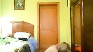 A hot chick is getting naked in front of a hidden camera