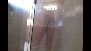The guy washed his body in the shower, not knowing he was being watched