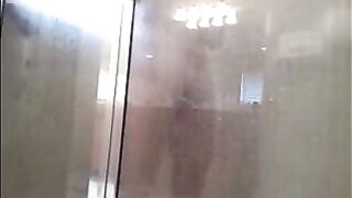 The guy washed his body in the shower, not knowing he was being watched