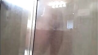 The guy washed his body in the shower, not knowing he was being watched
