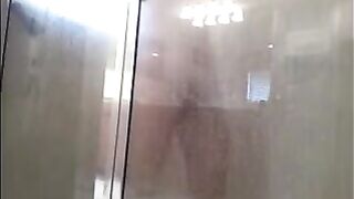 The guy washed his body in the shower, not knowing he was being watched