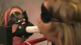 Two girls are having fun with each other with a tough entertainment