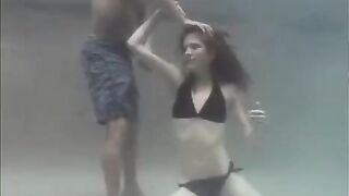 The underwater sex of the red-haired beauty in the pool is very hot