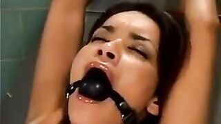 A bald guy forced the girl to have sex with him using a sex machine