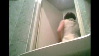 A girl pissed in the toilet, not knowing there was a camera