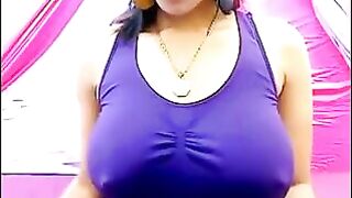 Her nipples are standing through the T-shirt with excitement