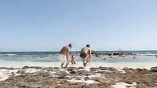 Blonde girl fucked by two guys on the beach