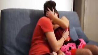 A girl shooting a video with her big brother at home