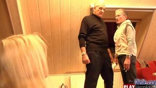 A young blonde with a gray beard has sex with a member