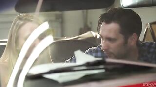 The couple is fucking passionately in the red car