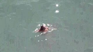 A pair of naked people are having fun at sea, it’s a wonder!