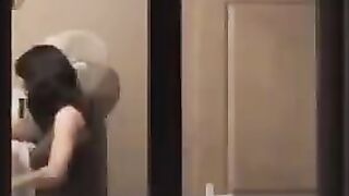 The guy admires himself in the mirror, standing completely naked in front of him