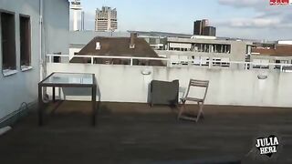 Brunette with big tits bouncing on the roof in HD