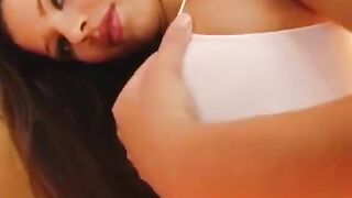 The girl plays with her wet vagina using a dildo in a close-up shot