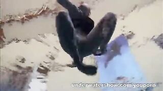 A sexy girl is floating in the pool without any clothes