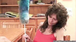 A mature woman plays with her pussy using a finger or a toy